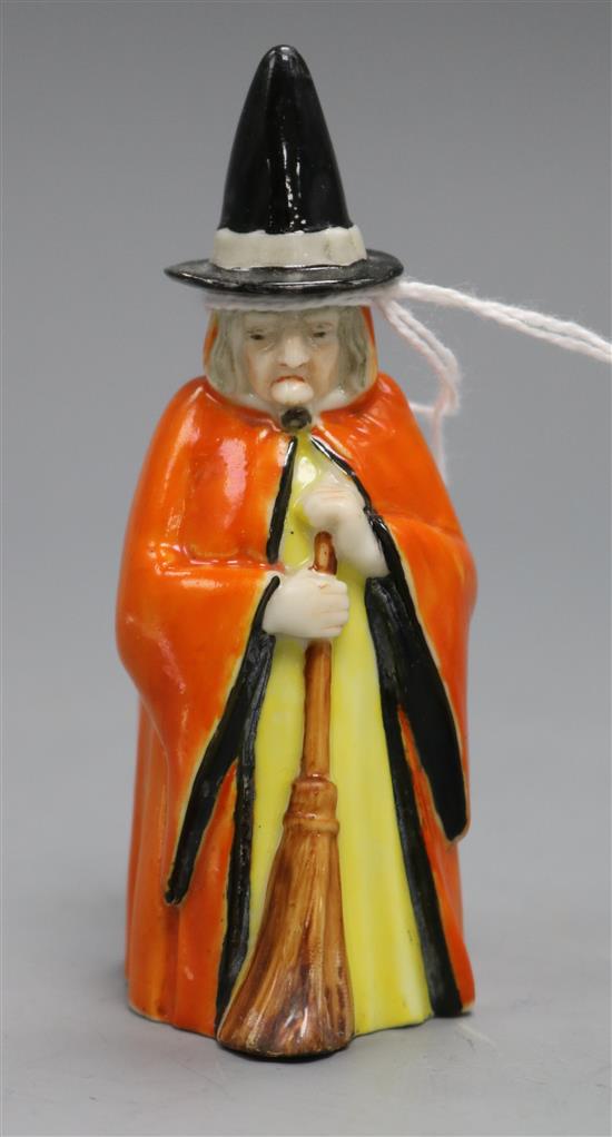 A Royal Worcester candle extinguisher in the form of a witch